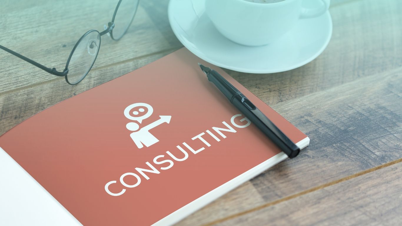 Tax consultant holding financial documents with a construction client, representing tax consulting services.
