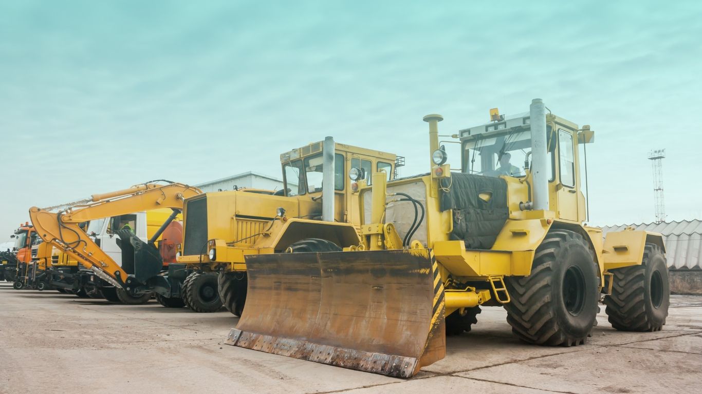 Construction equipment on a job site, representing equipment depreciation tax strategies.