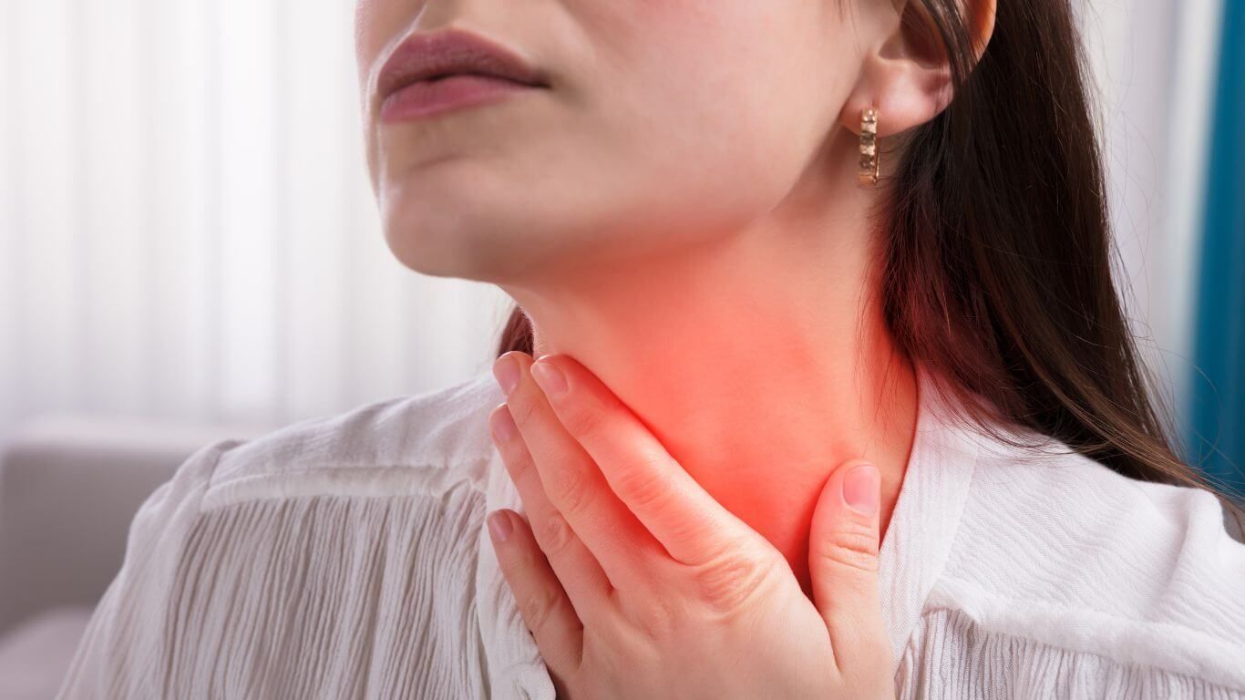 Close-up of a Woman Touching Her Throat, With a Red Highlighted Area — Tewantin Medical Centre In Tewantin, QLD