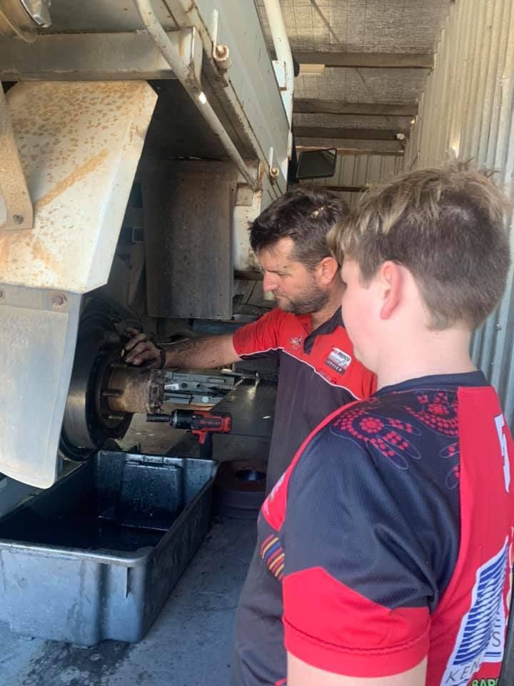 Two Men Are Working on a Machine in a Garage — Zilzie Workshop In Emu Park, QLD