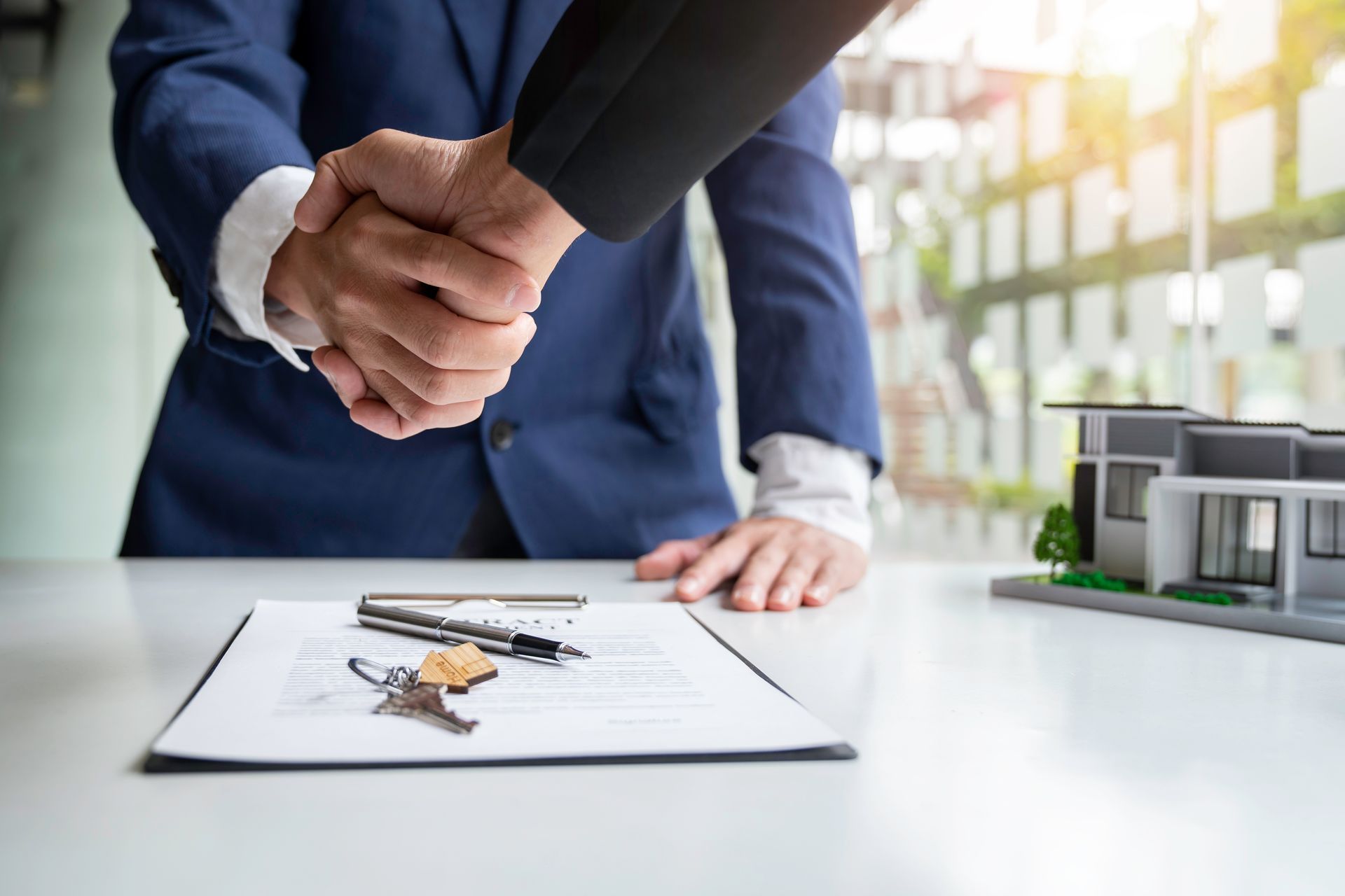 business man and appraiser shakehands