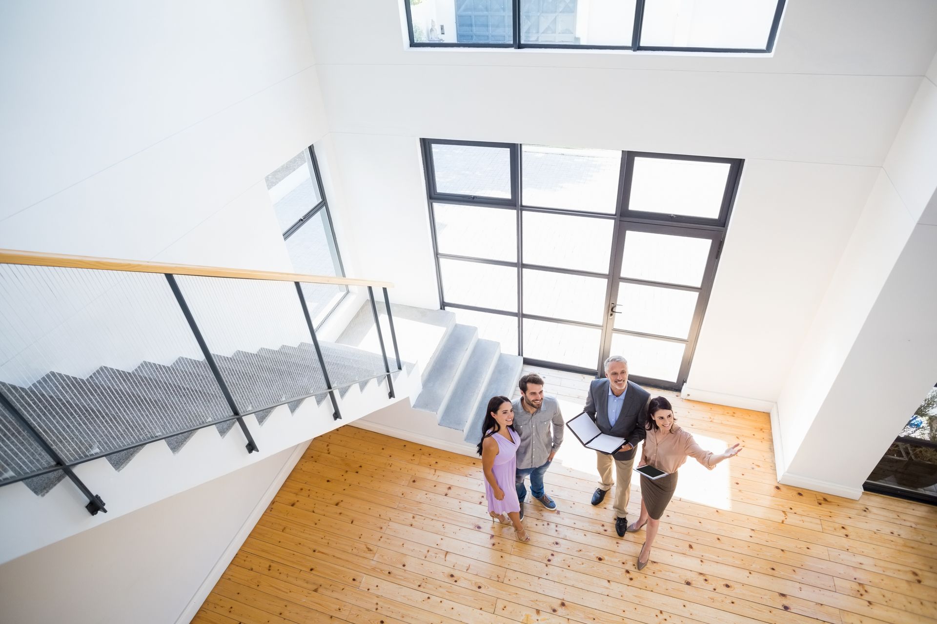 real estate agents touring their client inside the house
