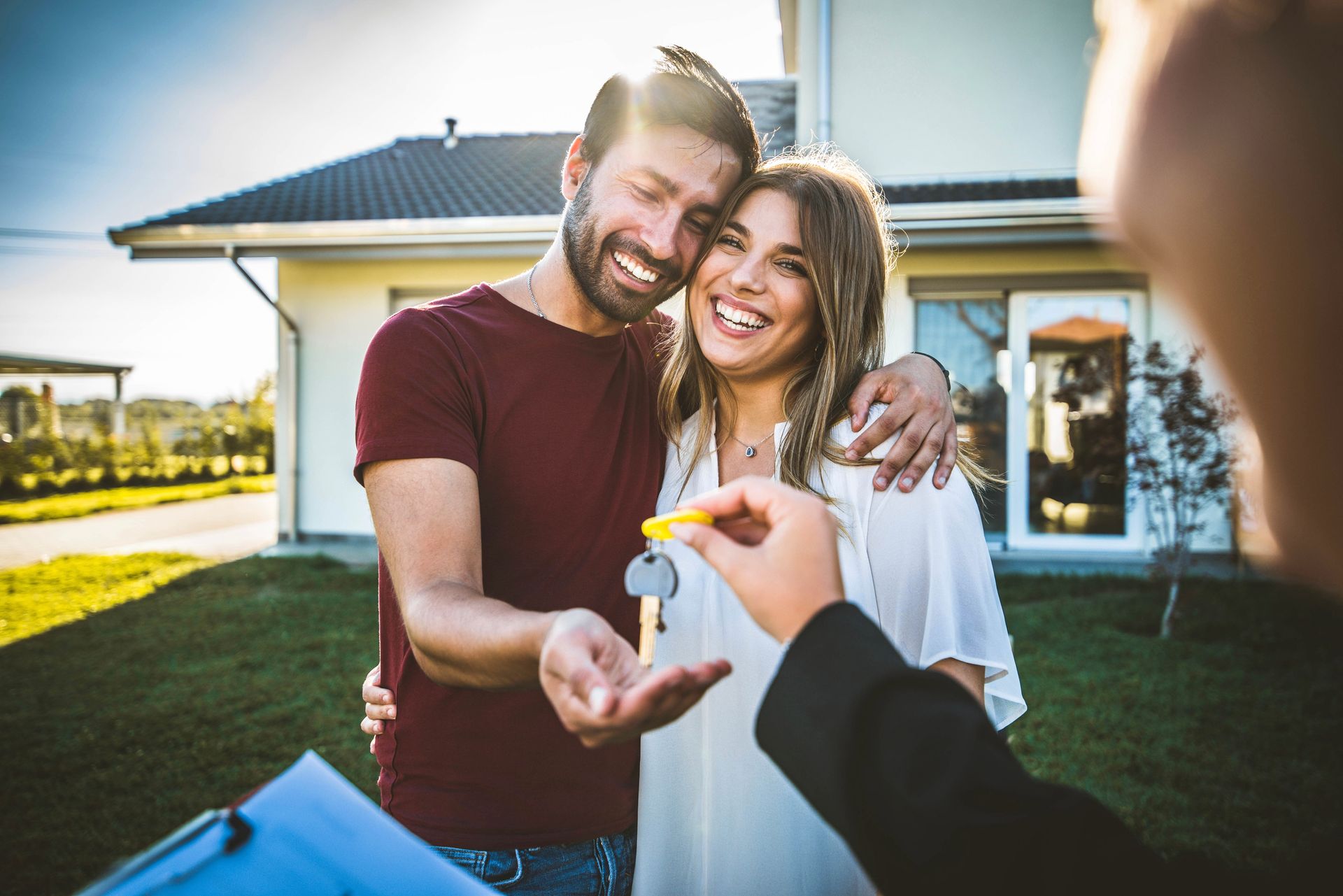 happy couplereceiving new house key