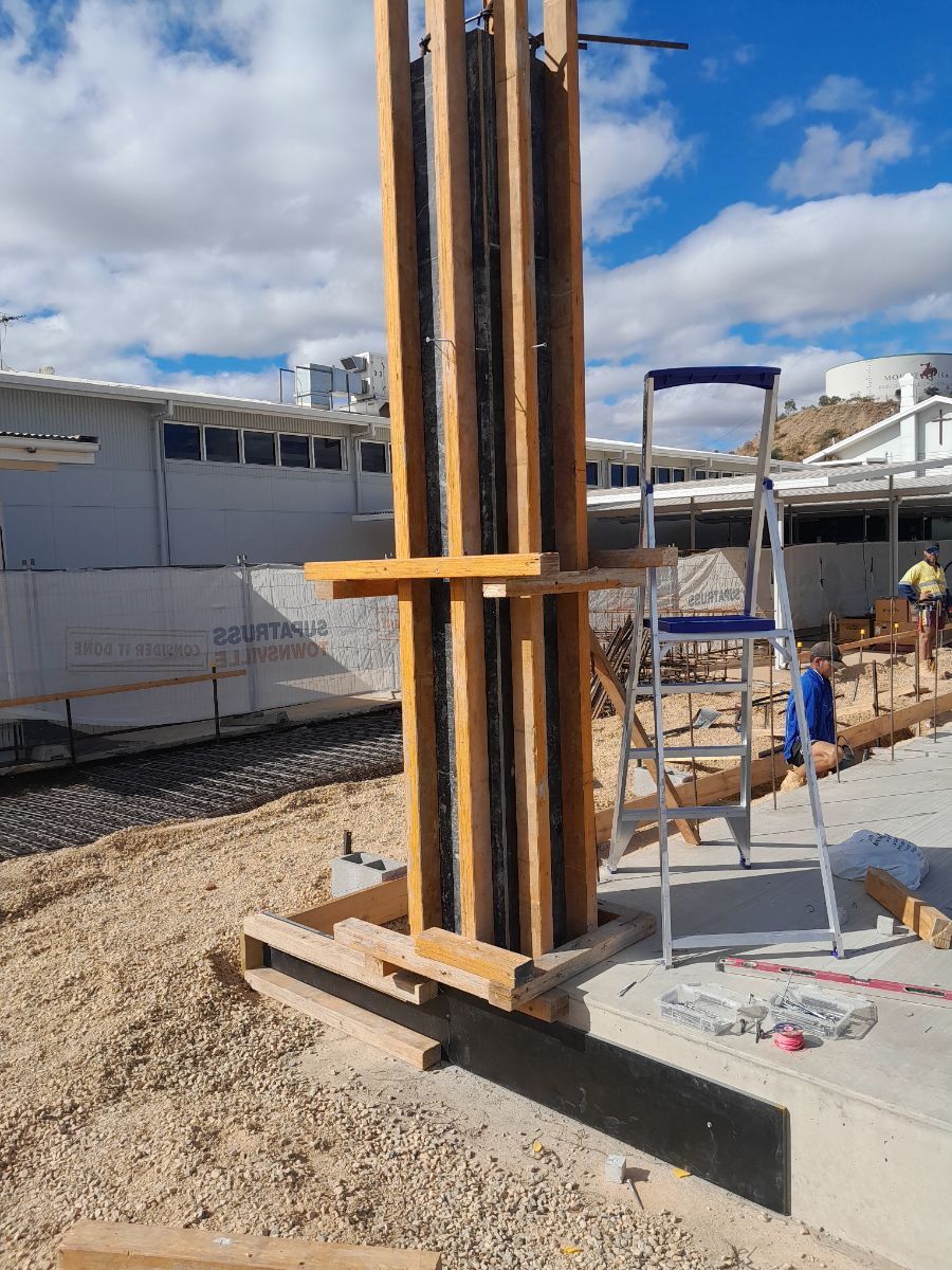 A large pole on a construction site— Bark Concreting In Ryan, QLD