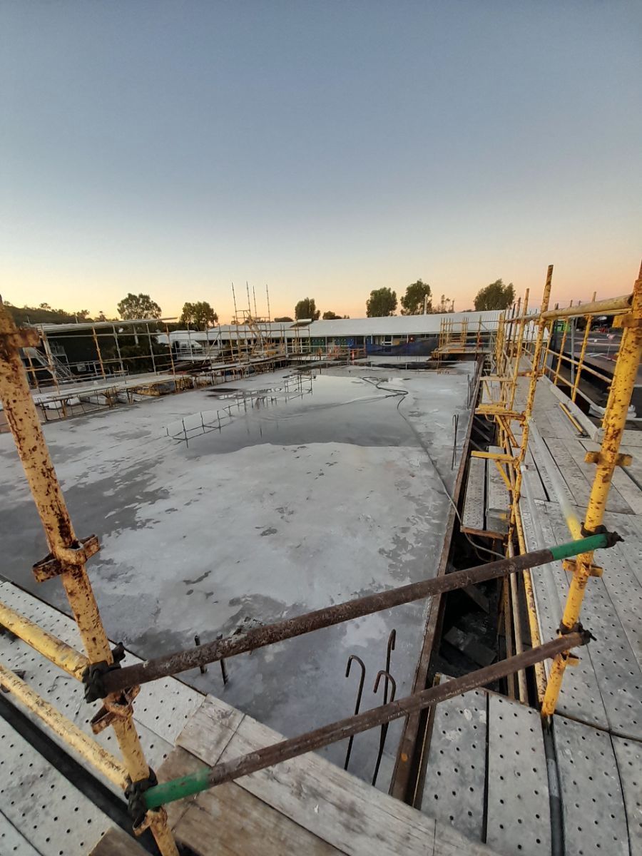 A Construction Site With Scaffolding  — Bark Concreting In Ryan, QLD