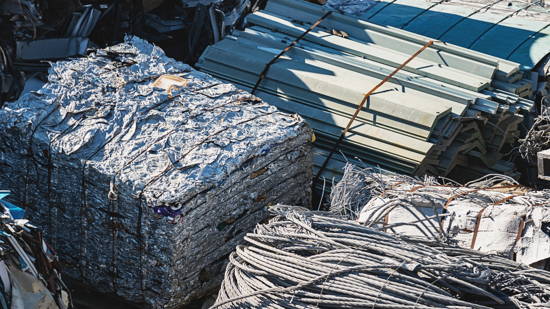 A pile of scrap metal is stacked on top of each other.