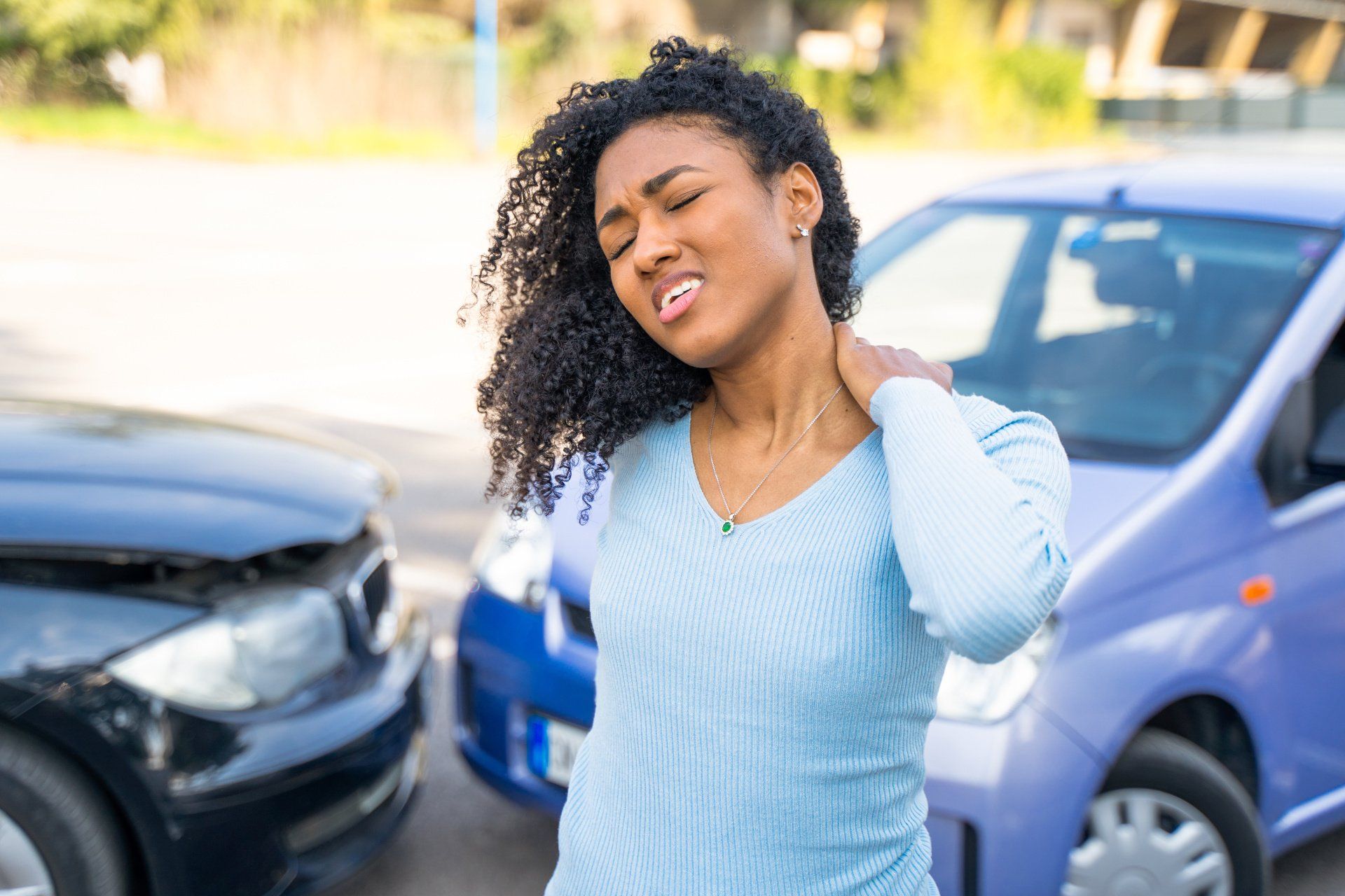 black woman with whiplash after accident
