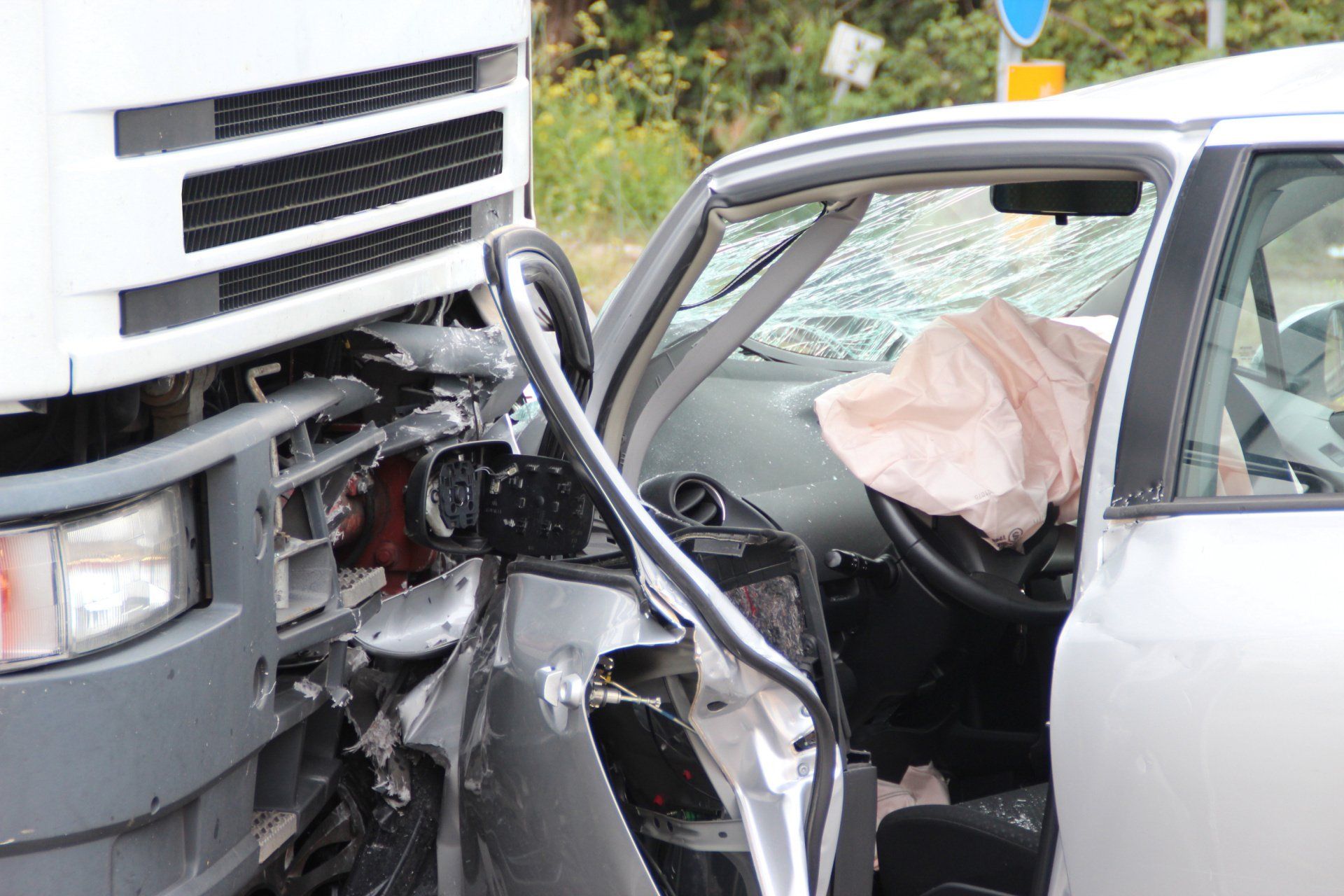 semi truck crashing into a car