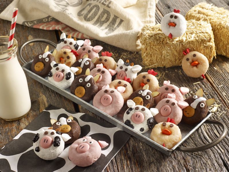 variety of mini donuts in a metal serving dish decorated as barnyard animals