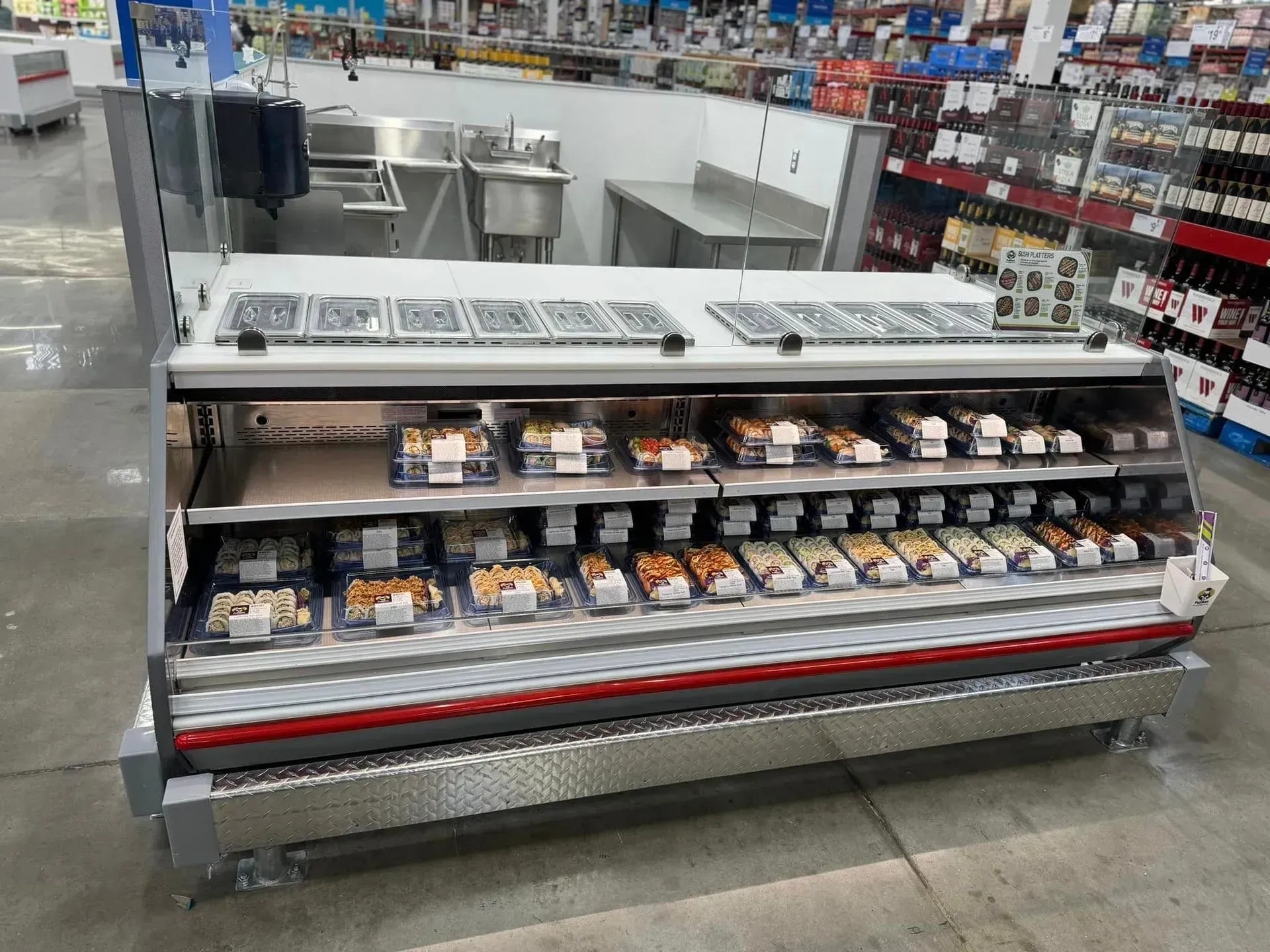 A display case in a grocery store filled with food