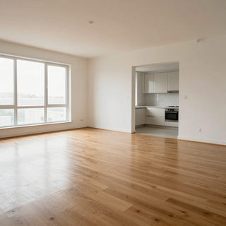 Bright empty apartment living room with large window and open kitchen, wood floors and white walls