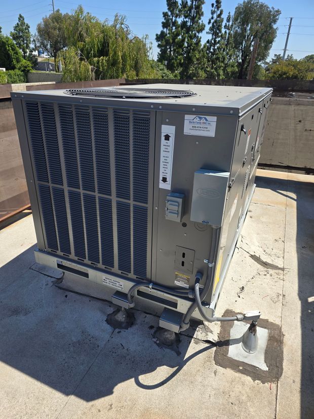 Blue gas flames on an industrial boiler in a metal utility room