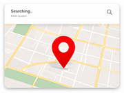 Map screen with red location pin and a “Searching…” bar at the top