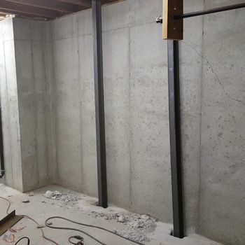 vertical steel restraints in basement