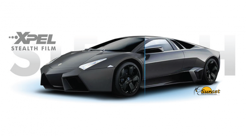 Black sports car with XPEL Stealth film branding on a white background