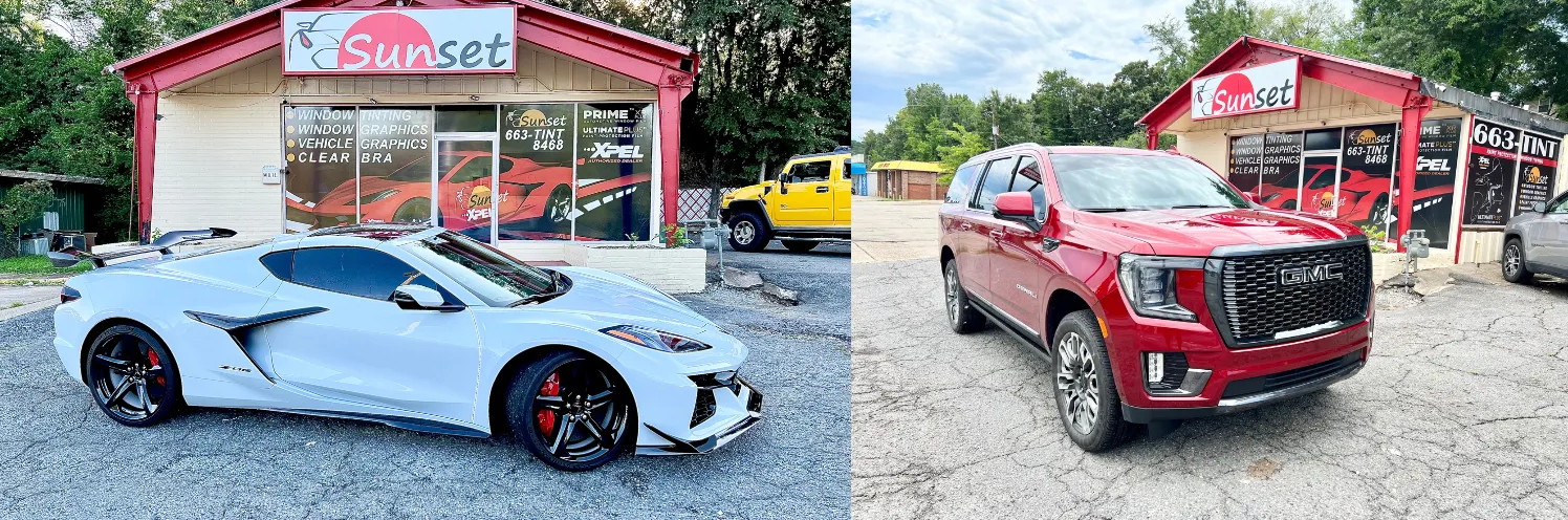 Two sports cars parked outside a red storefront, one silver and one red, on a gravel lot