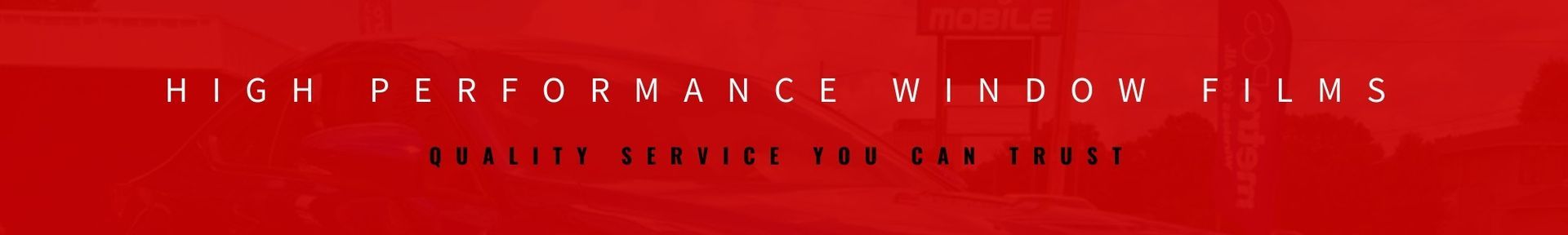 Red website banner with faint text across a bright red textured background.