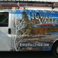 River Valley Air conditioning van with mountain and tree mural and website text on the side
