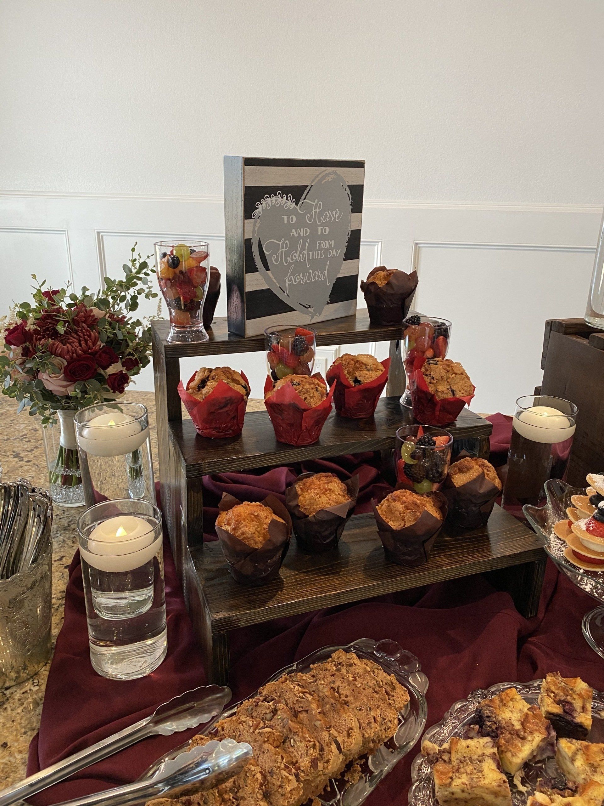 A table topped with a variety of desserts and cupcakes.