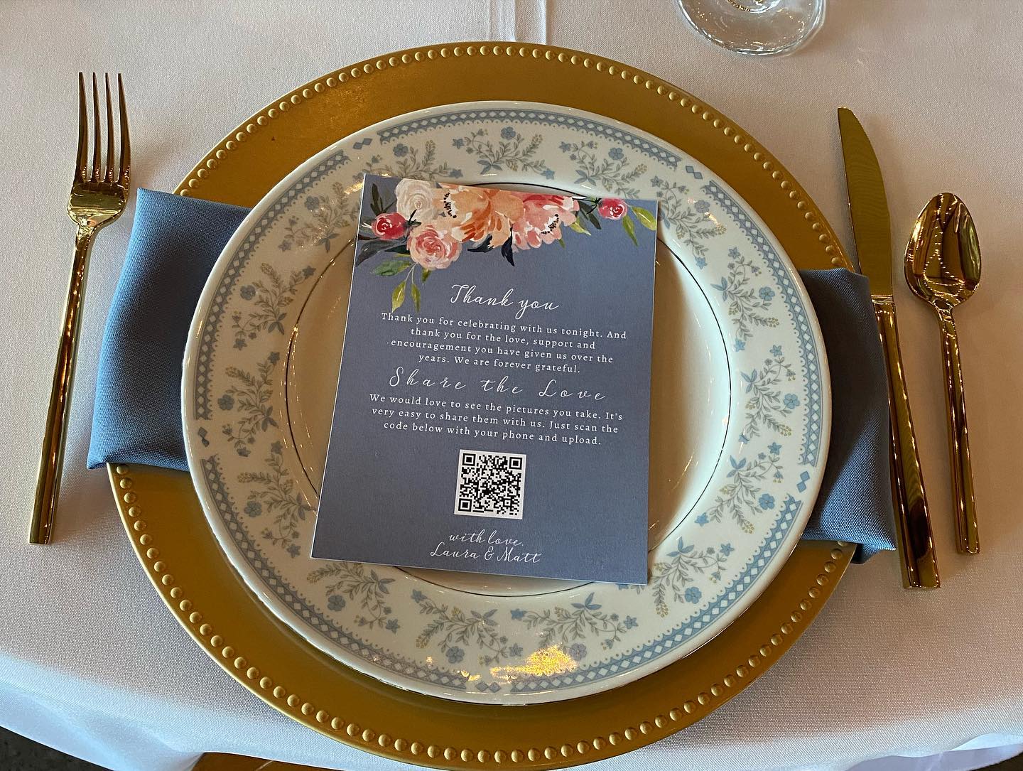 A plate with a menu on it is on a table with silverware.