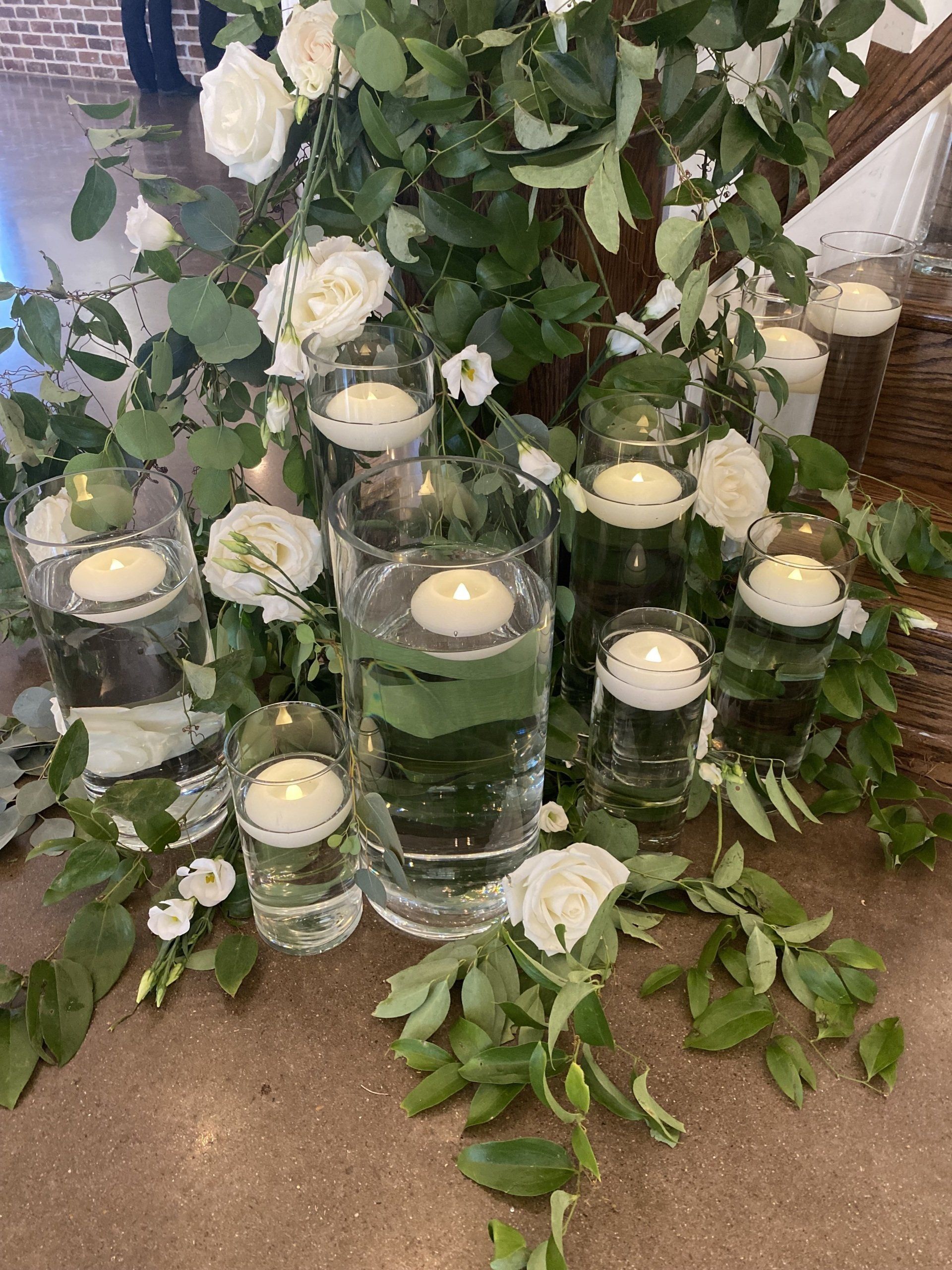 A table decorated with candles and flowers on it.