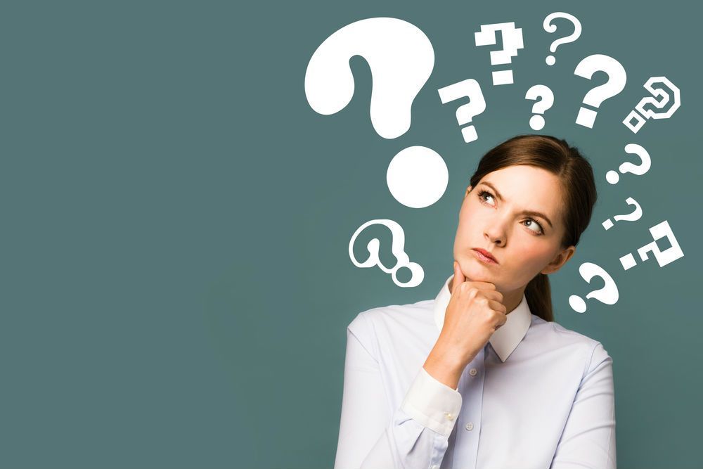 Business woman with question marks