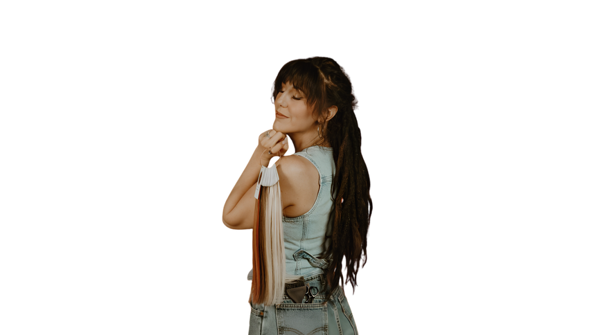 Woman with long braids holding a baseball bat over her shoulder on a white background