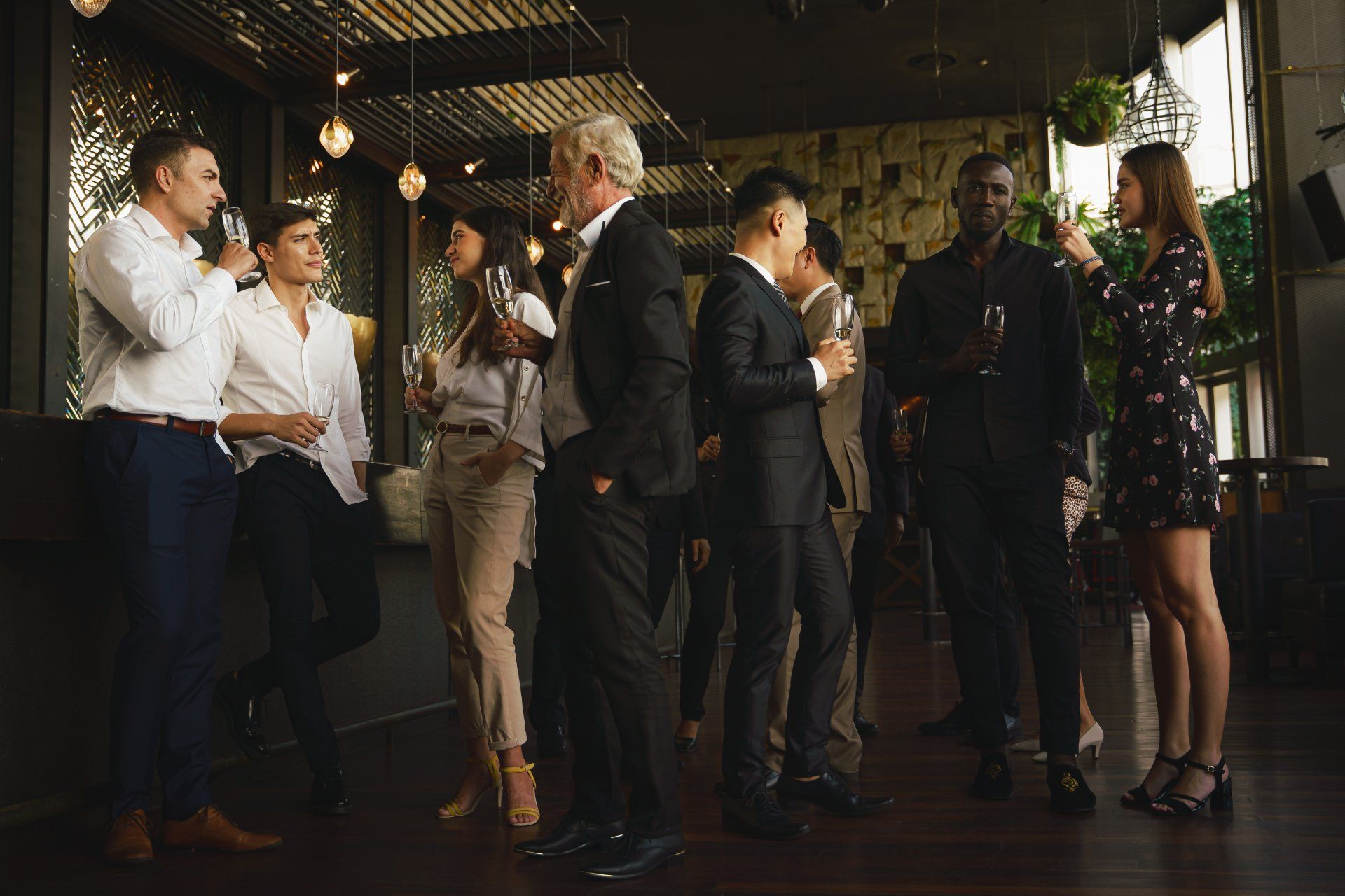 corporate businesspeople having fun and talking together in corporate party in club to celebrate spacial event such as corporate anniversary