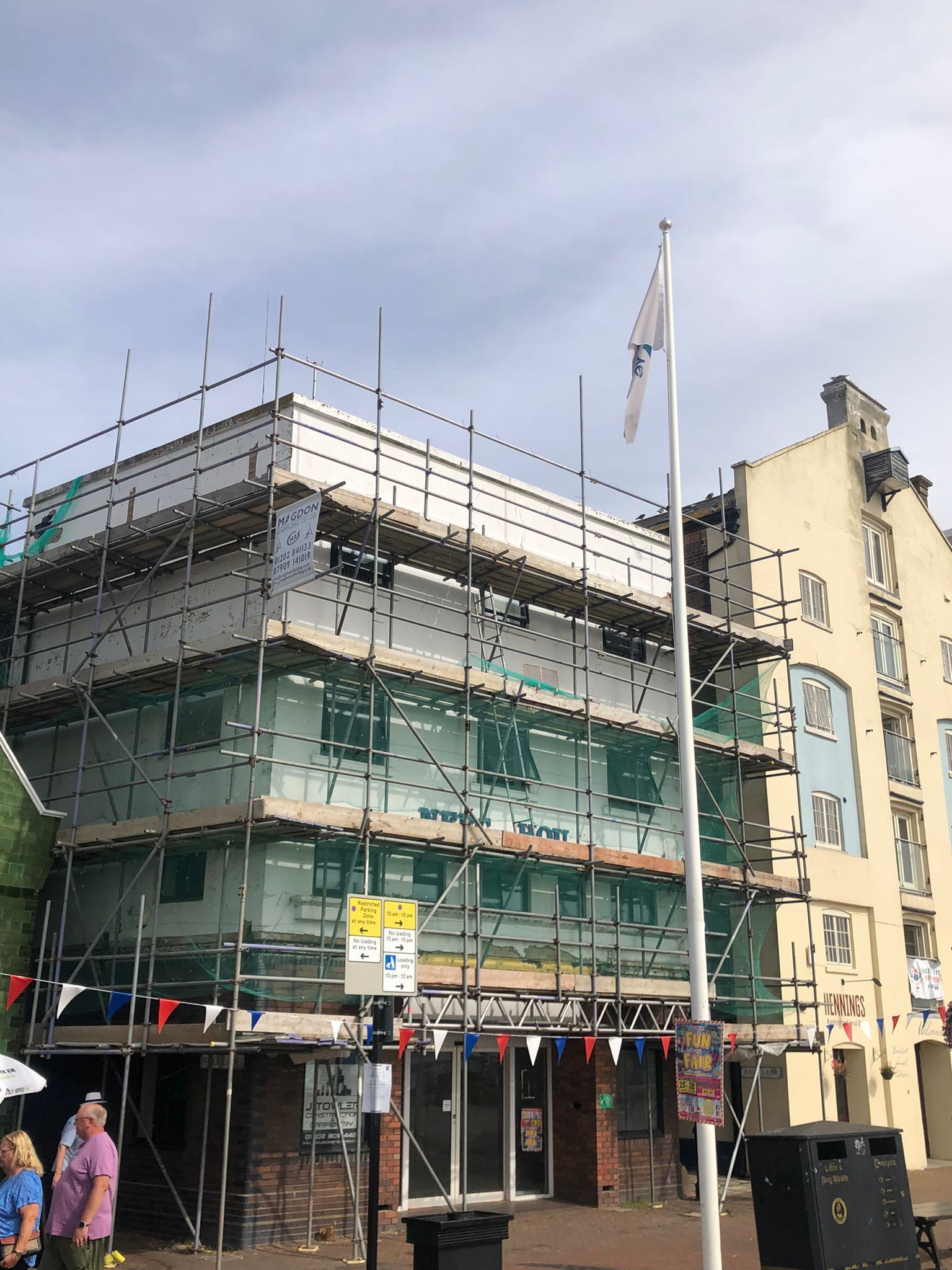 This is a photo of a Commercial building in Leicester with a scaffolding tower up. this was done by Leicester Scaffolding Services JK