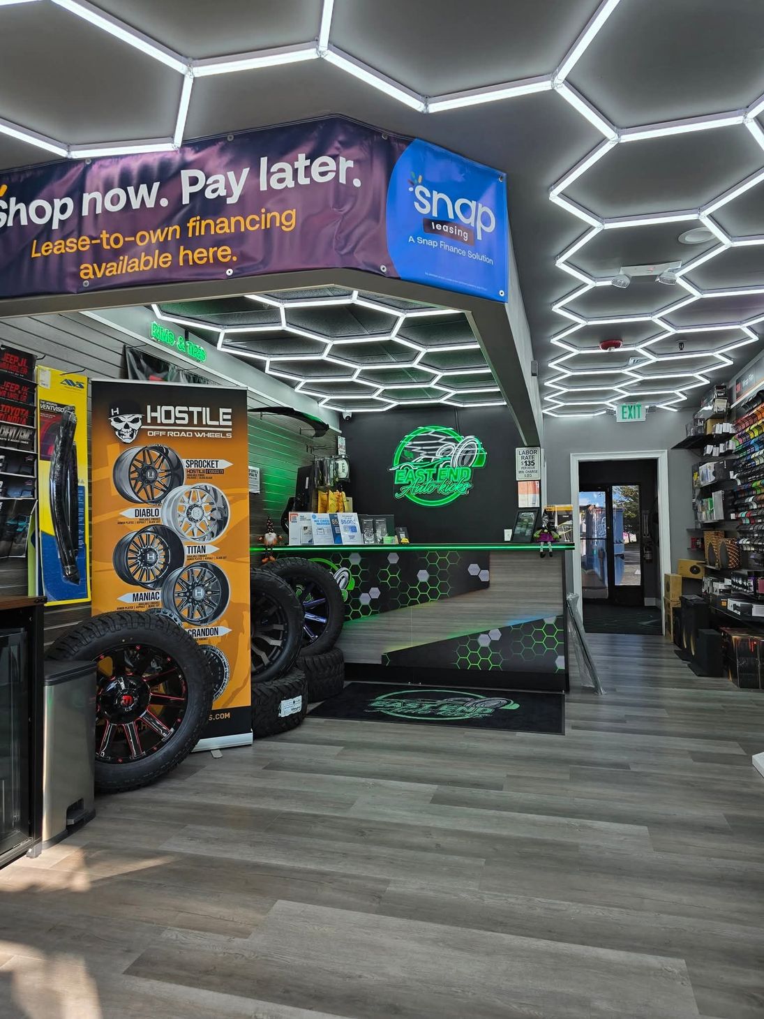 Entrance to East End Auto Kicks and auto repair and upgrade shop with neon green accents | East End Auto Kicks