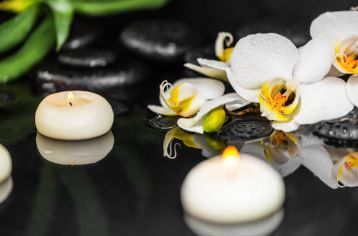 Orchids and candles representing cremation services in PA
