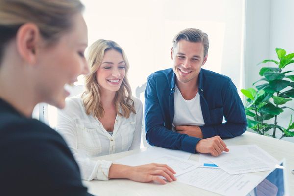 Insurance Agent with Couple — Fairhope, AL — Empower Insurance Solutions Insurance Agent with Couple — Fairhope, AL — Empower Insurance Solutions