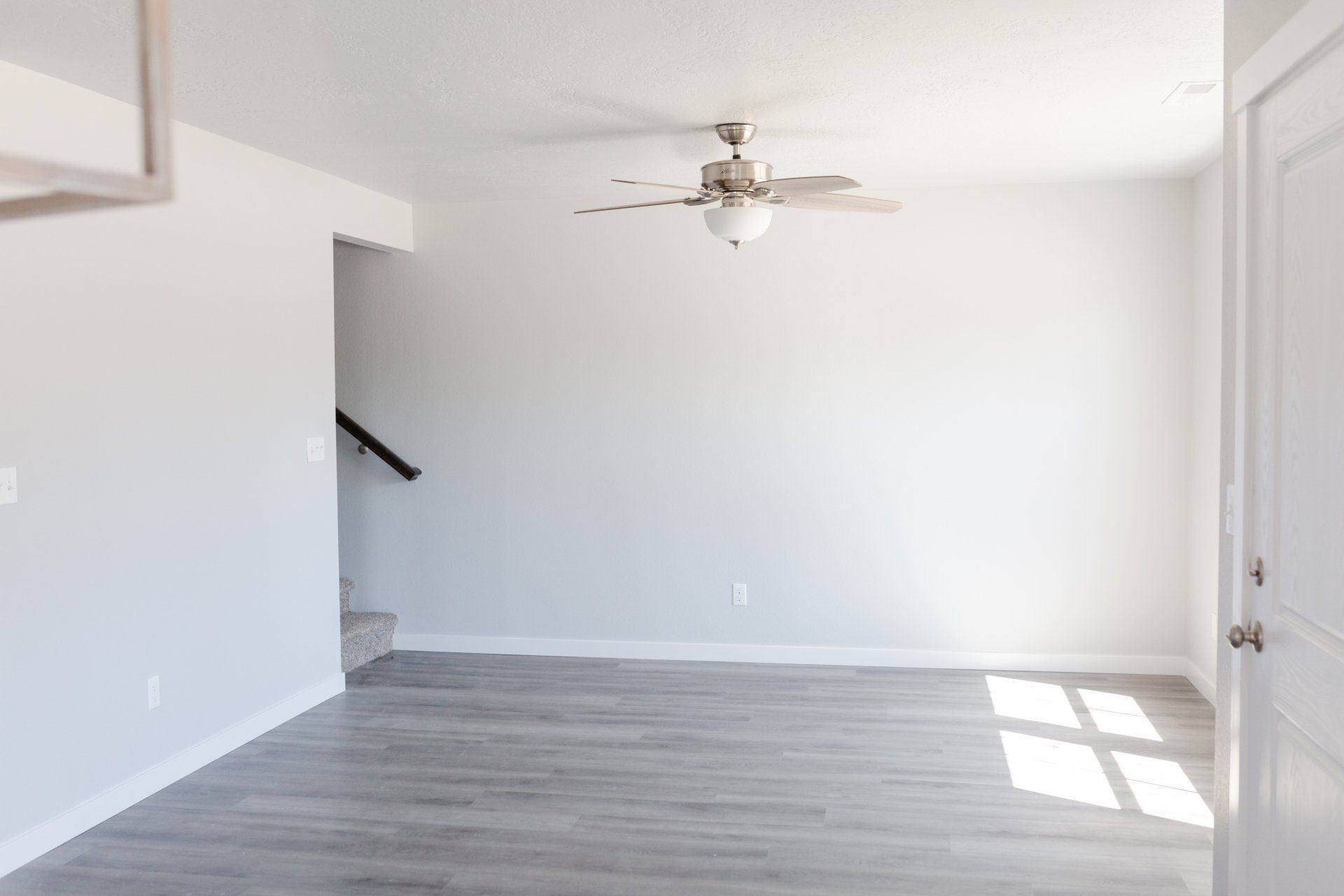 living room with ceiling fans