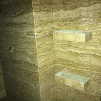 stone shower with shelves