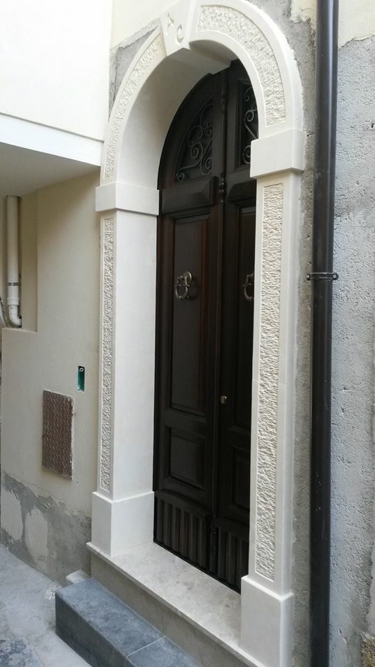 arched door with white stone jamb