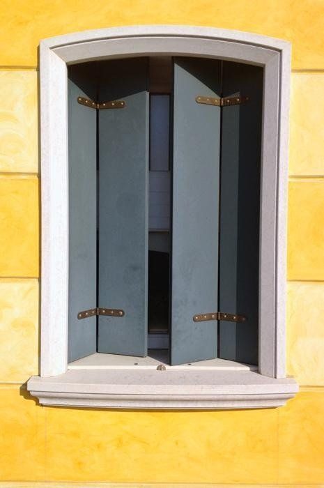 window with stone jamb and folding opening
