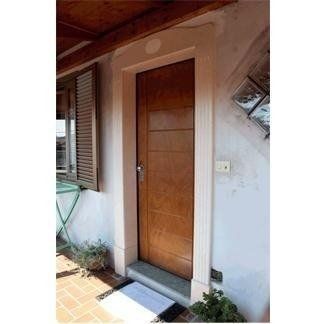 front door with white stone jamb