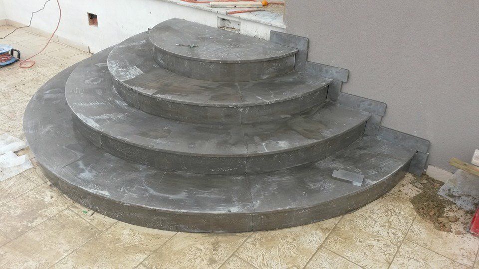 grey round stone staircase