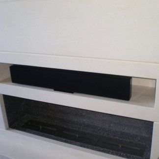 gas fireplace with white stone structure