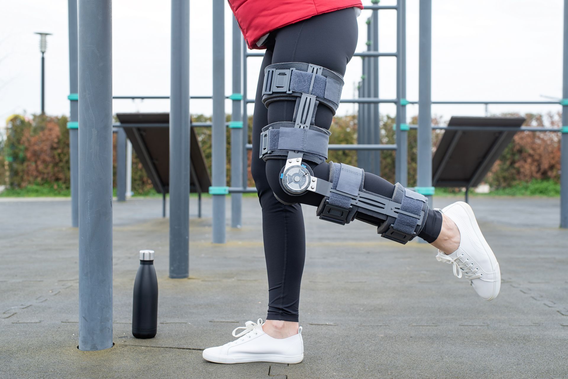 A person is wearing a knee brace on their leg.