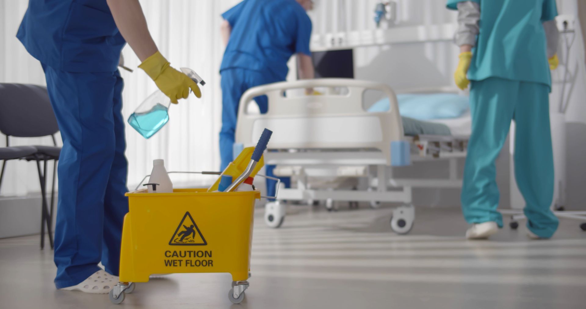 Cleaning the hospital room.