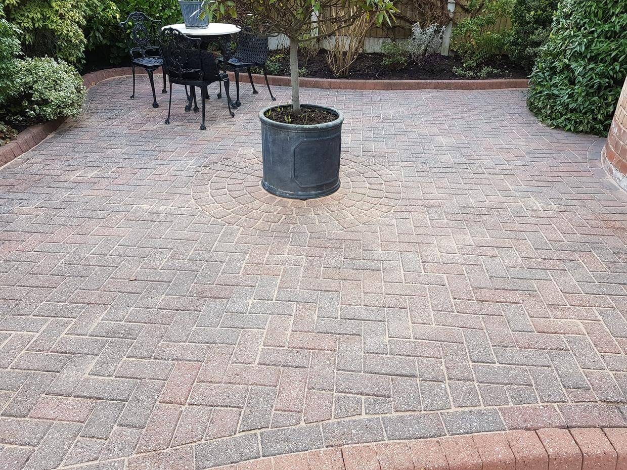 After cleaning moss and dirt we re-sand the block paving. driveway Moss removal in Cheshire