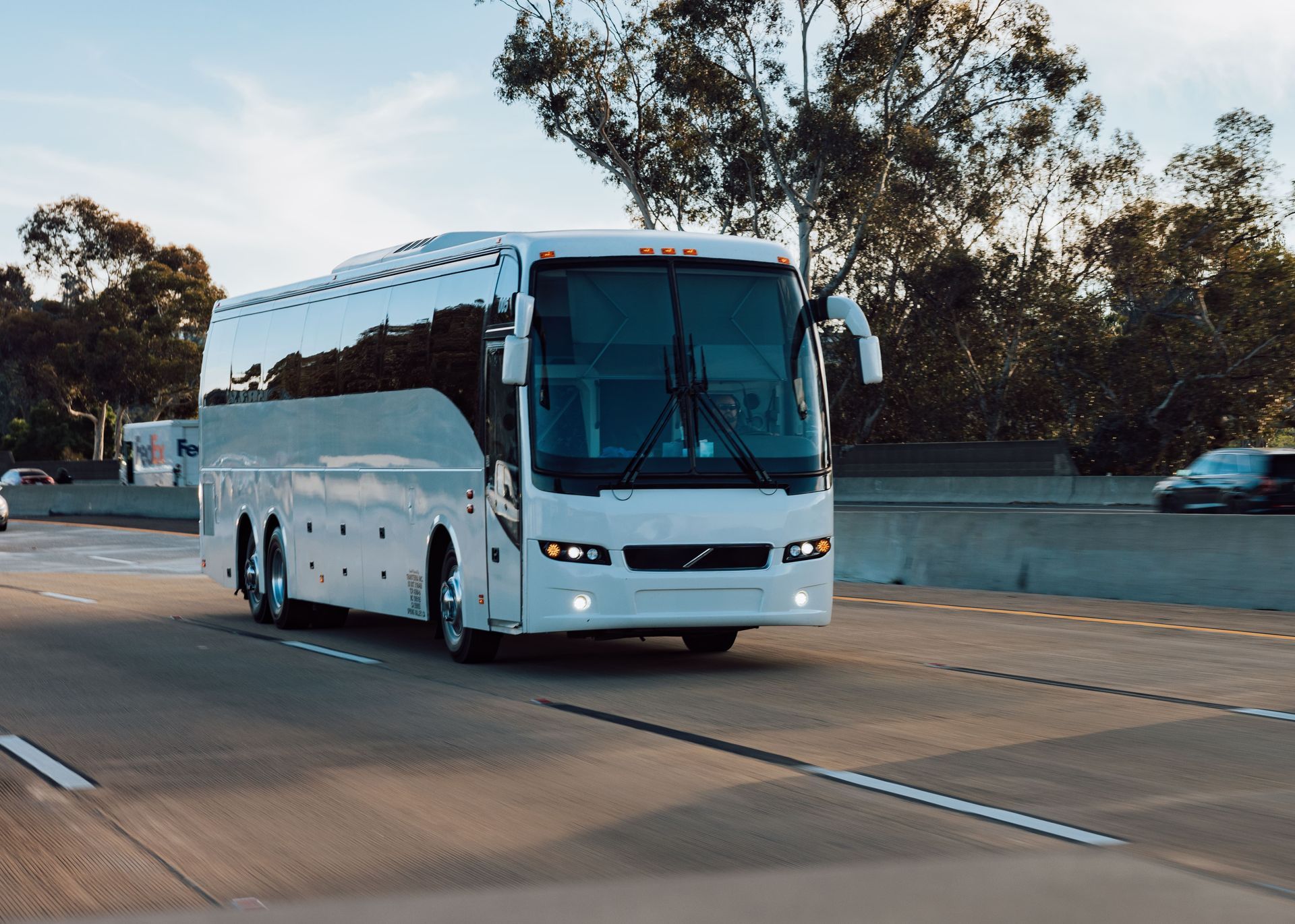Family group traveling together on a charter bus rental in San Diego