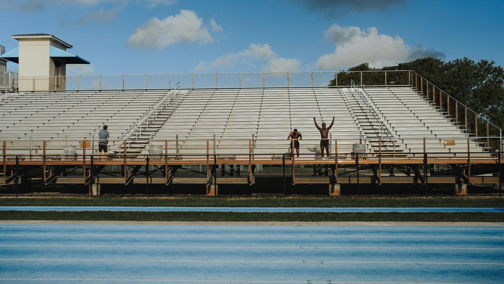Fans cheering from bleachers at San Diego sporting event