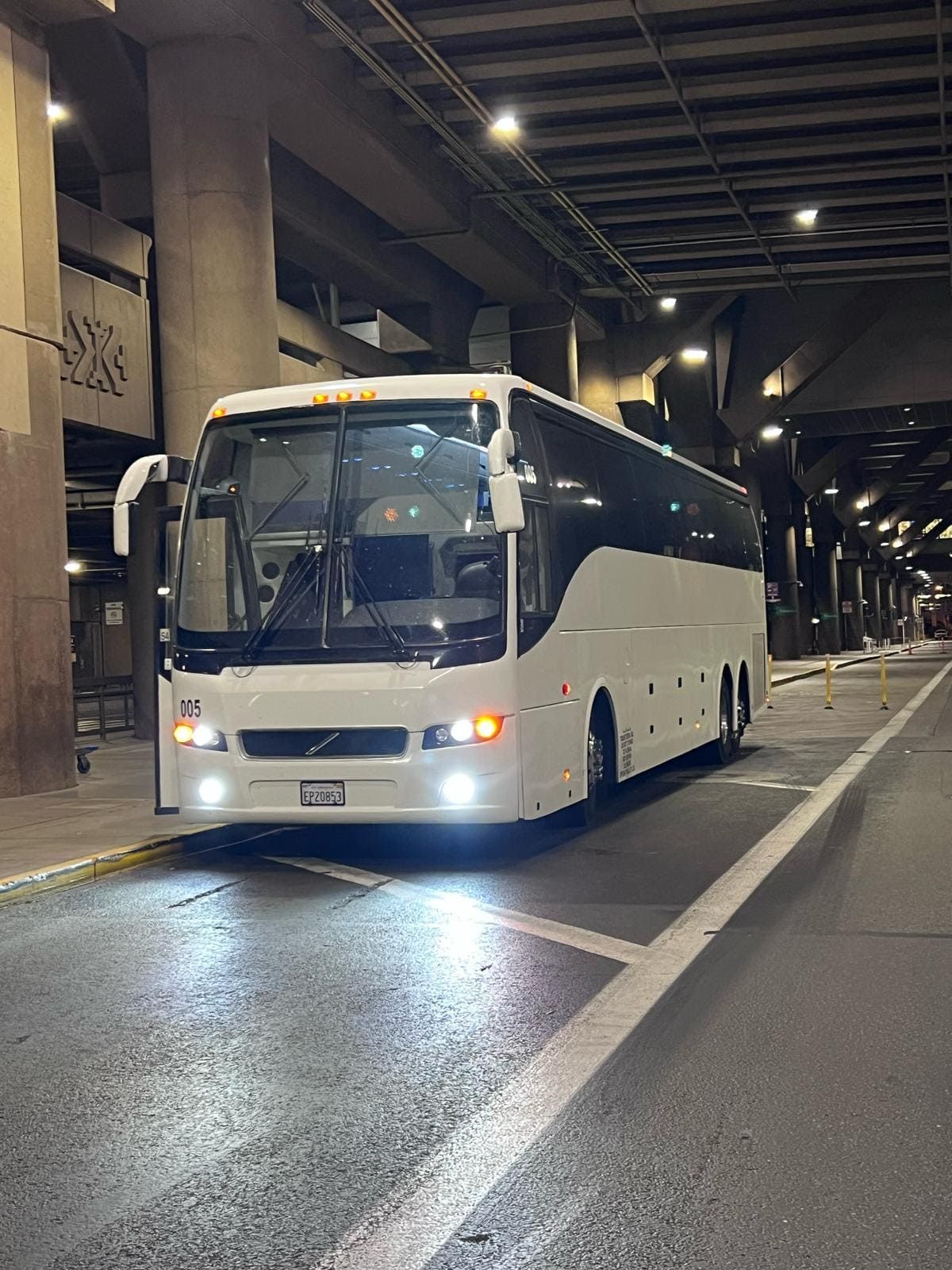 Full size charter bus at San Diego airport ready for group pickup and travel