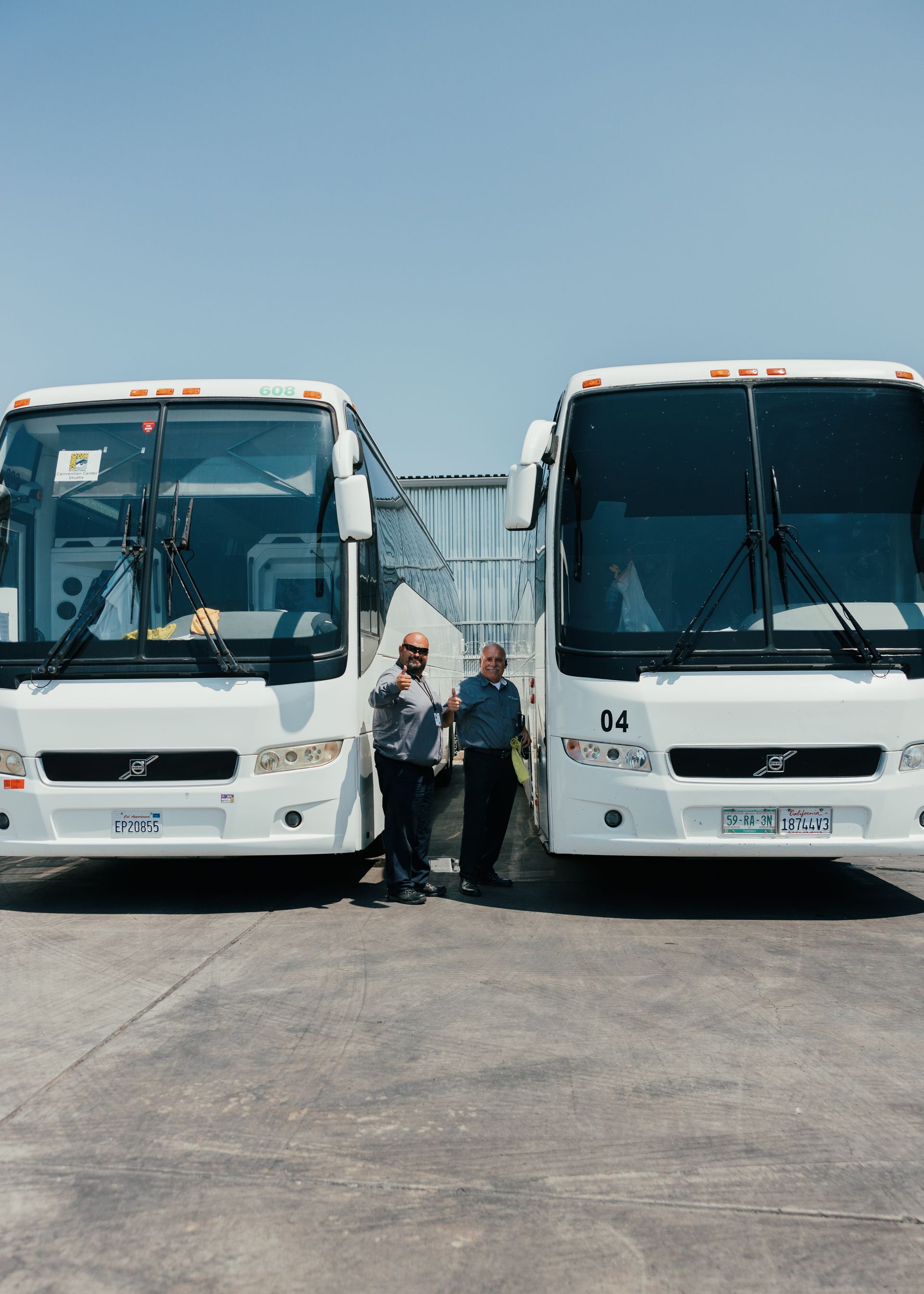 Charter buses with driver ready for group trip