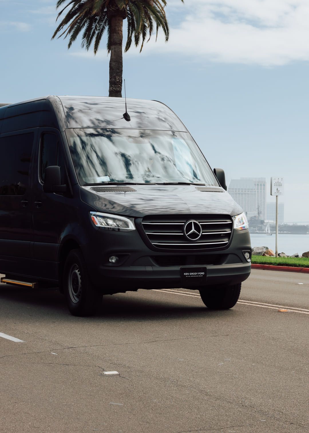 Closeup of sprinter van rental San Diego driving for group travel