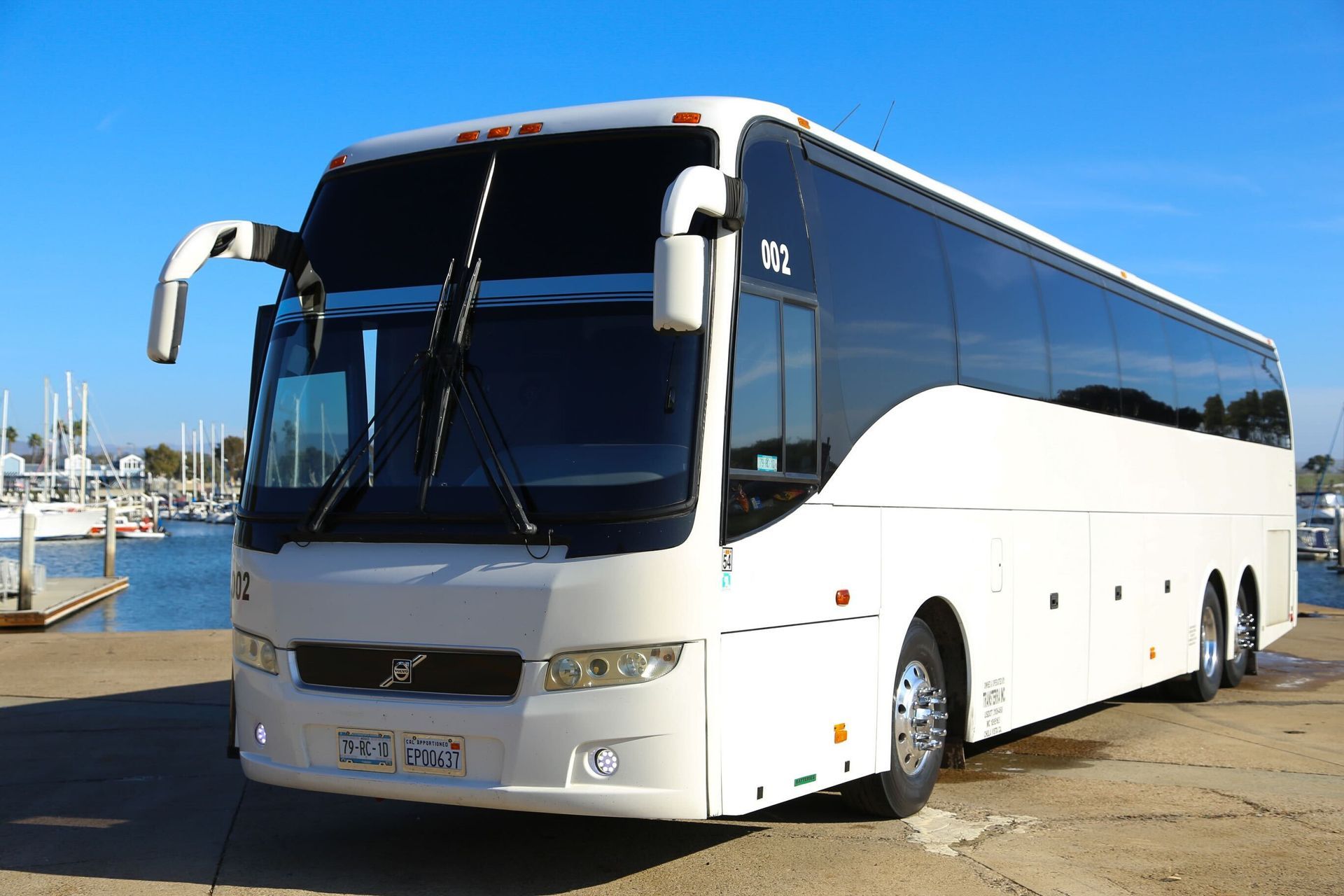 Guests boarding bus at San Diego waterfront location
