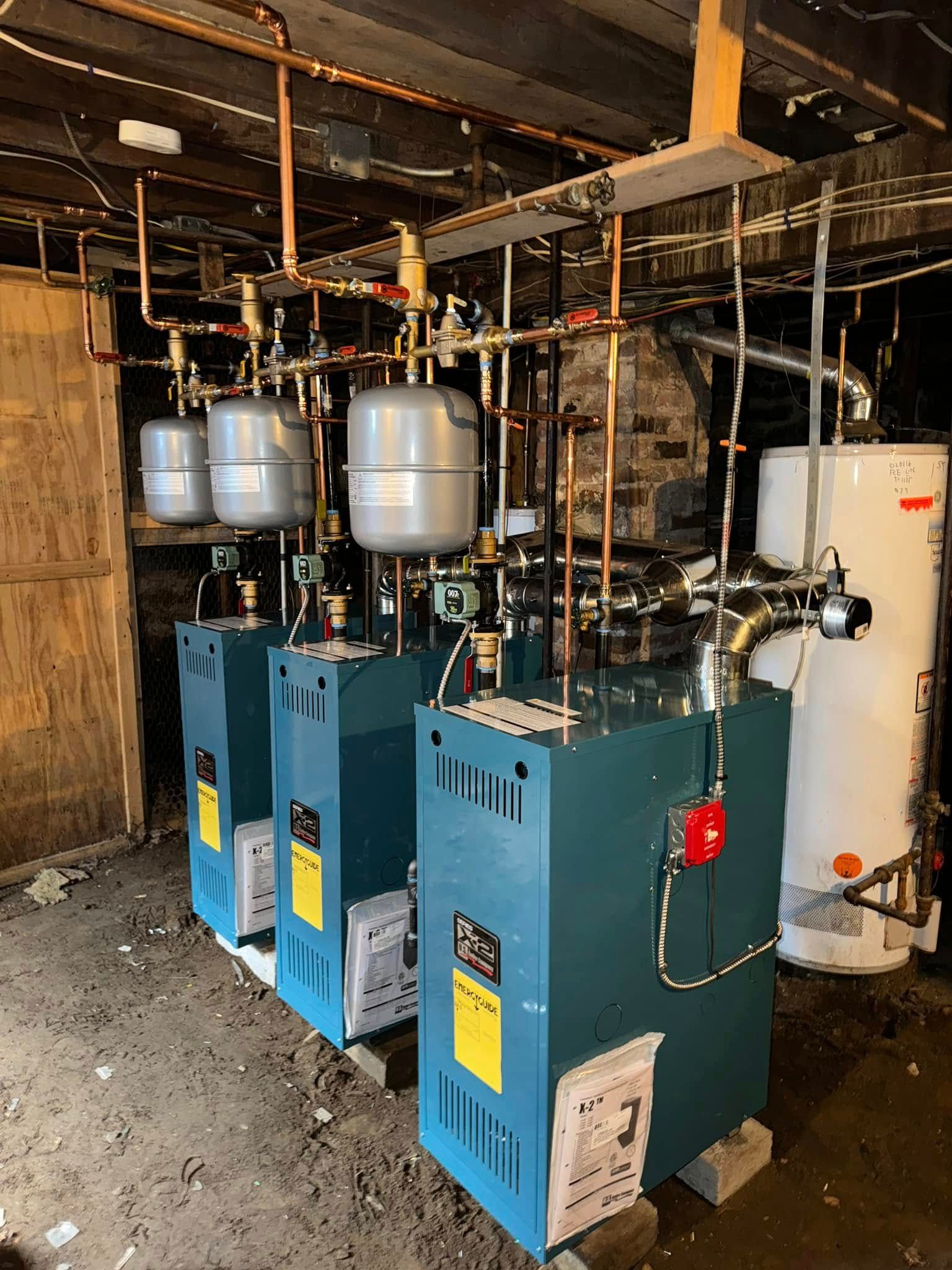 A bunch of silver beads are sitting on top of each other on a blue surface.