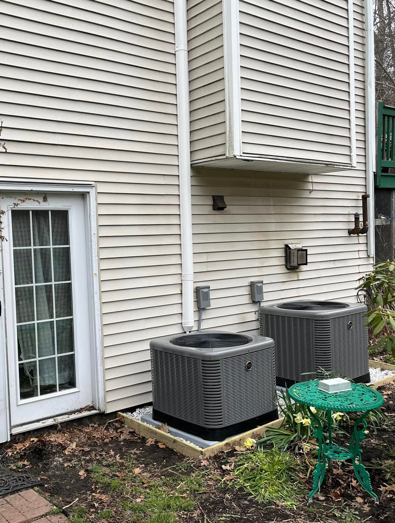 A pair of buttons are sitting on top of a black cloth.